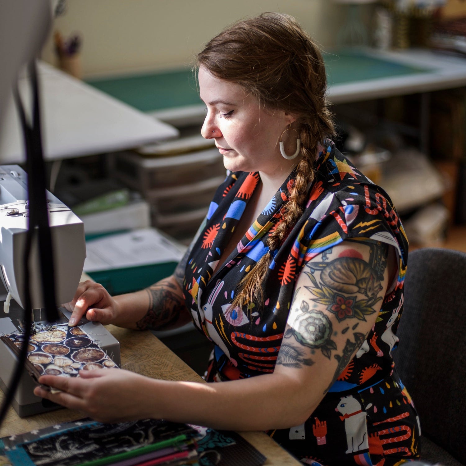 Person working at a computer in a workshop setting